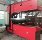 Dished head spinning machine
